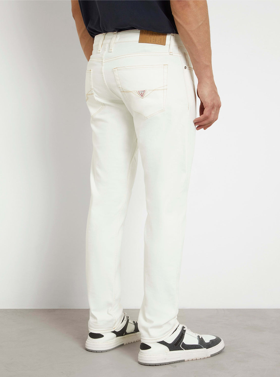 White Low-Rise Slim Tapered Jeans in White Wash