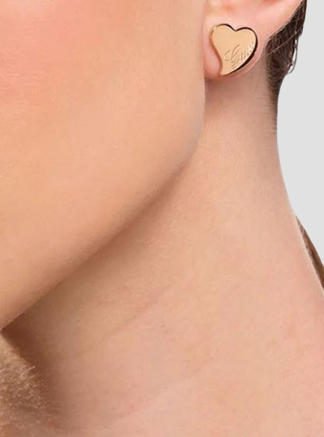 GUESS Womens Rose Gold Love Heart Stud Earrings UBE28048ROSEGOLD Model View