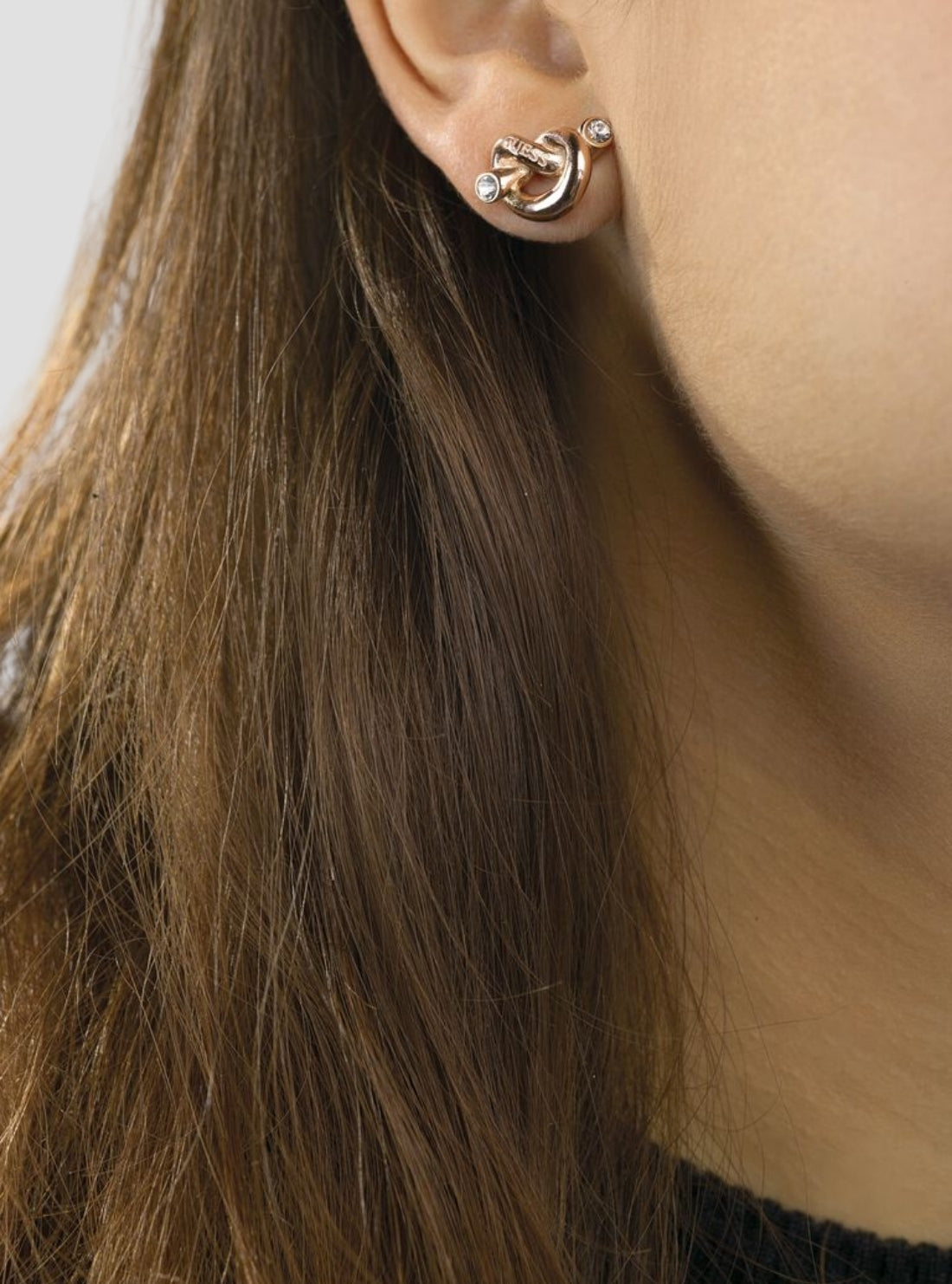 GUESS Accessories Rose Gold Knot Stud Earrings UBE29014ROSEGOLD Model View