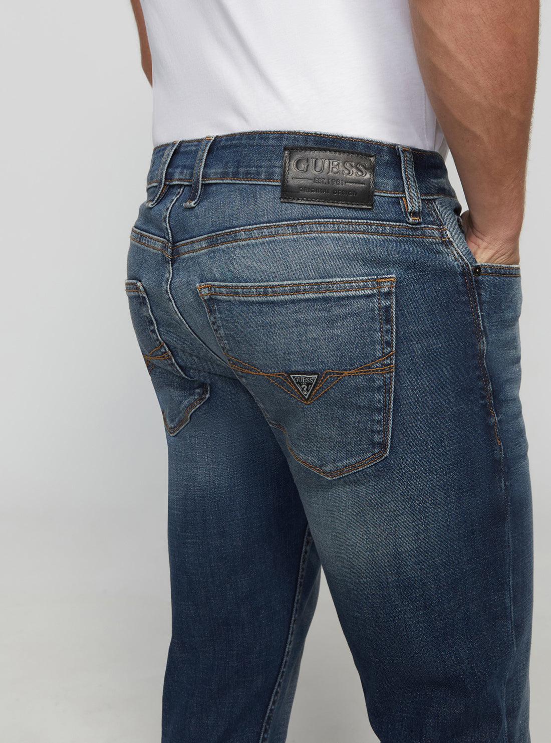 GUESS Men's Eco Low-Rise Slim Tapered Denim Jeans In Stratus Blue Wash MBGAS230411 Detail View