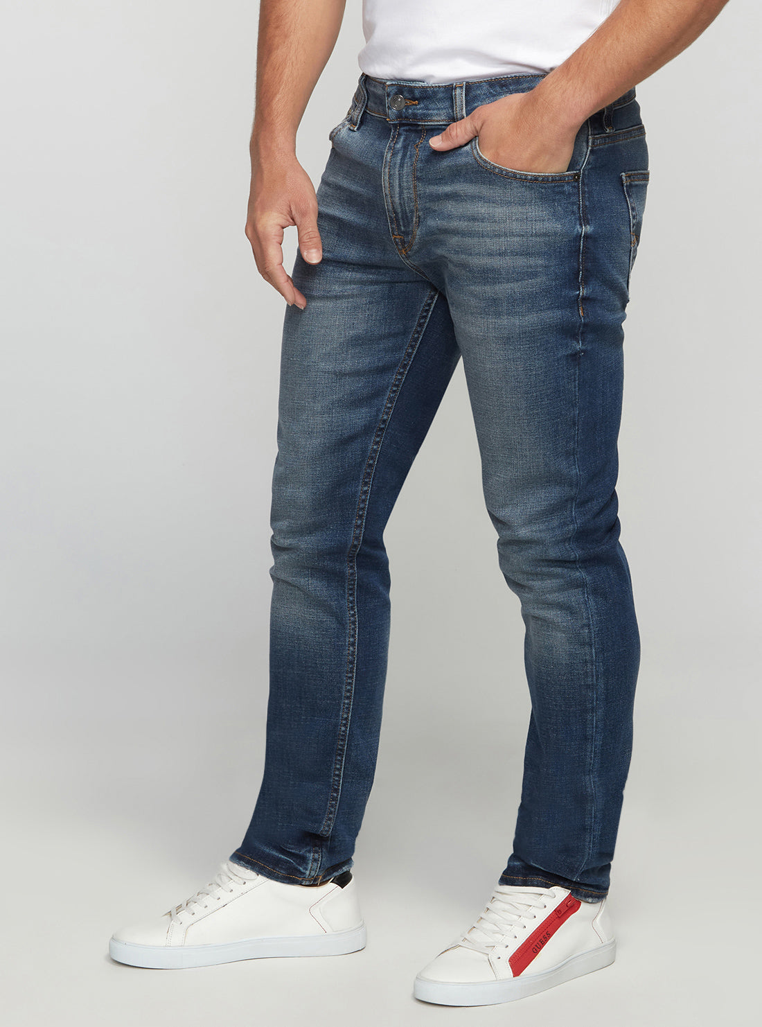 GUESS Men's Eco Low-Rise Slim Tapered Denim Jeans In Stratus Blue Wash MBGAS230411 Side View